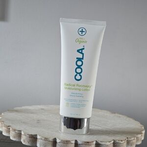 COOLA Radical Recovery Lotion with Blue Text